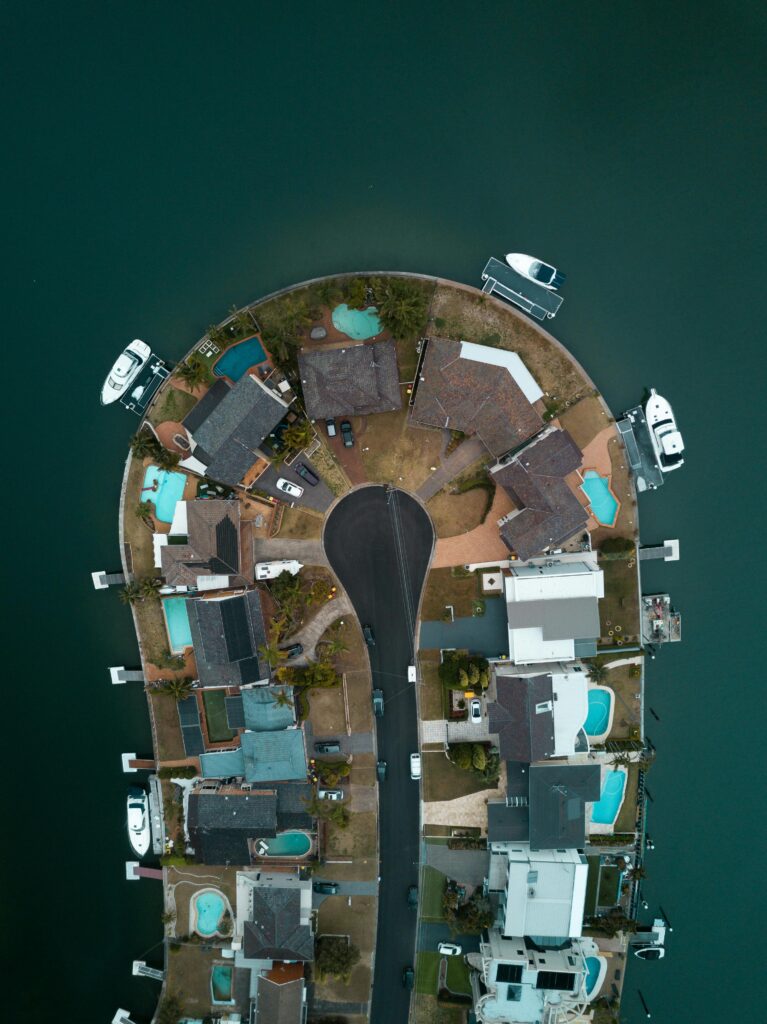 Drone shot capturing luxury waterfront homes in Sylvania Waters, Australia.